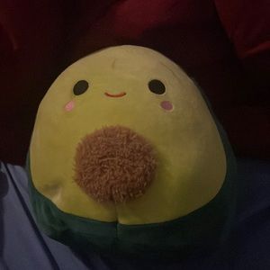 A soft avacodo plushy with a fluffy nut